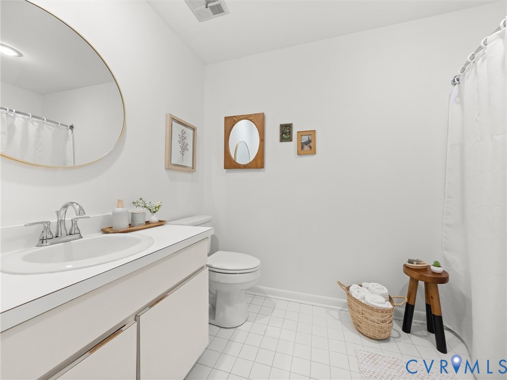 1625 Stone River Road North Chesterfield, VA 23235 - Photo 27 of 49 Bathroom featuring white tile flooring, a single v