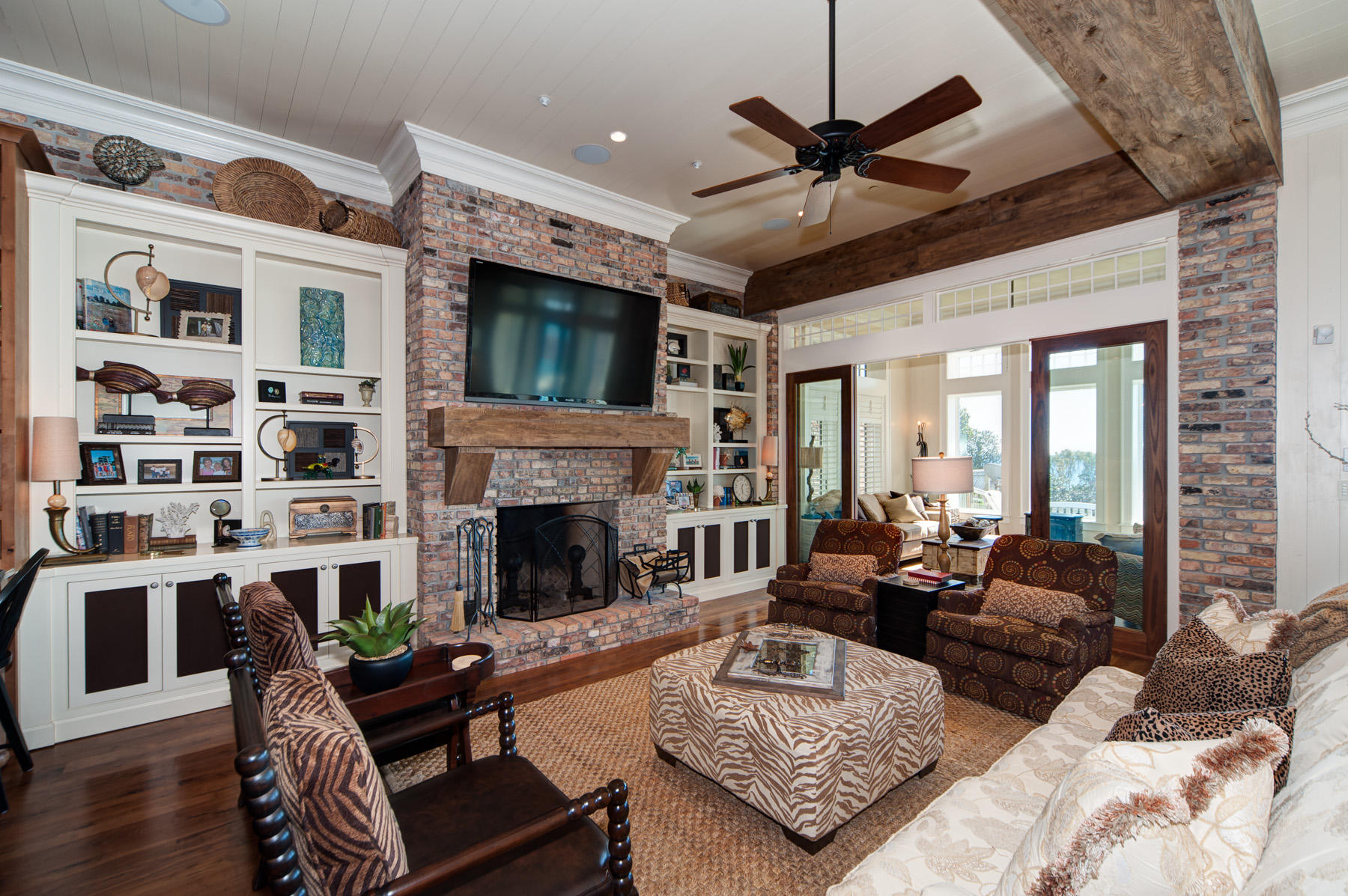 768 Blue Mountain Road Santa Rosa Beach, FL 32459 - Photo 7 of 32 a living room with furniture a fireplace and a large window