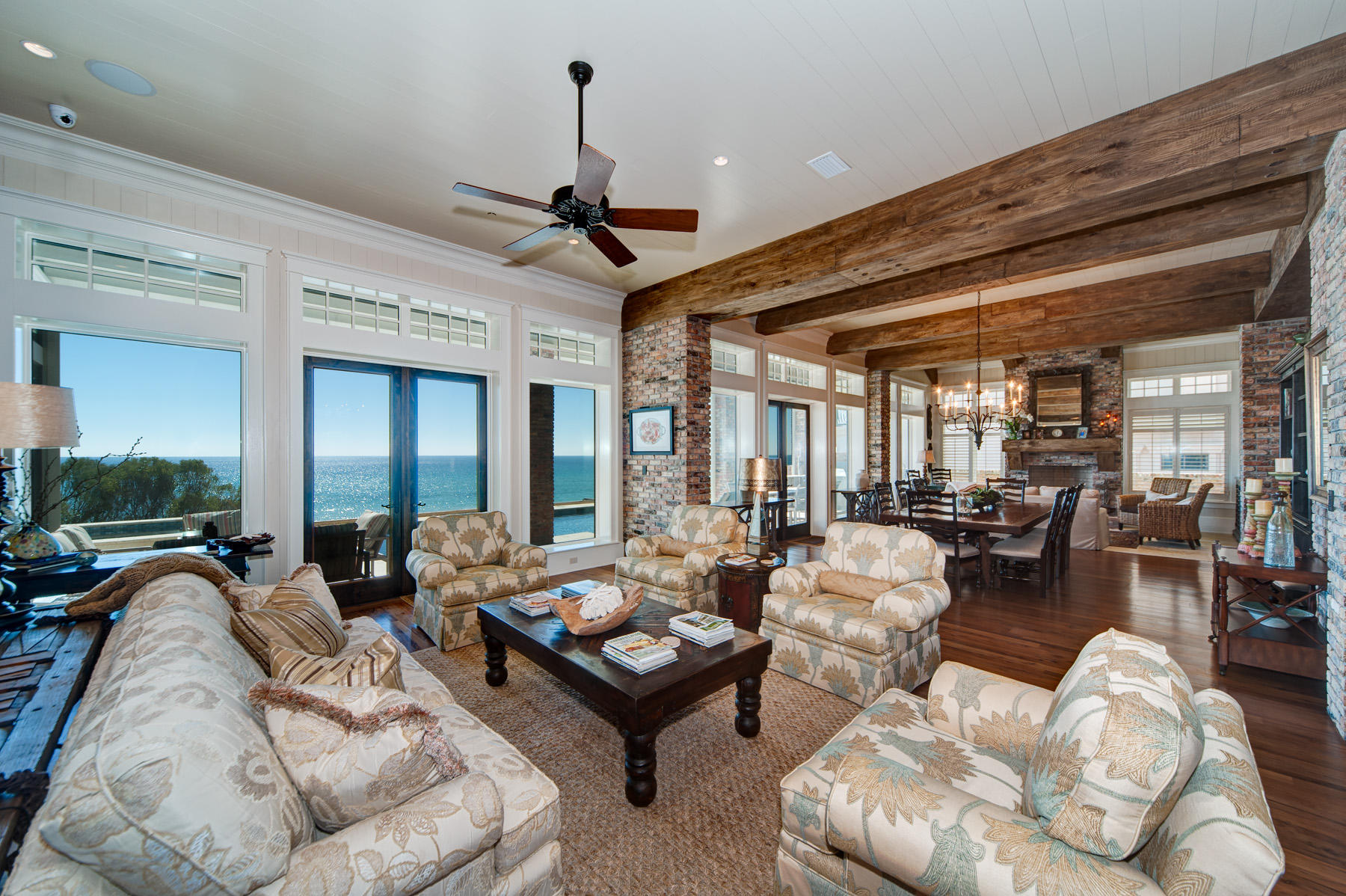768 Blue Mountain Road Santa Rosa Beach, FL 32459 - Photo 8 of 32 a living room with furniture ceiling fan and a rug