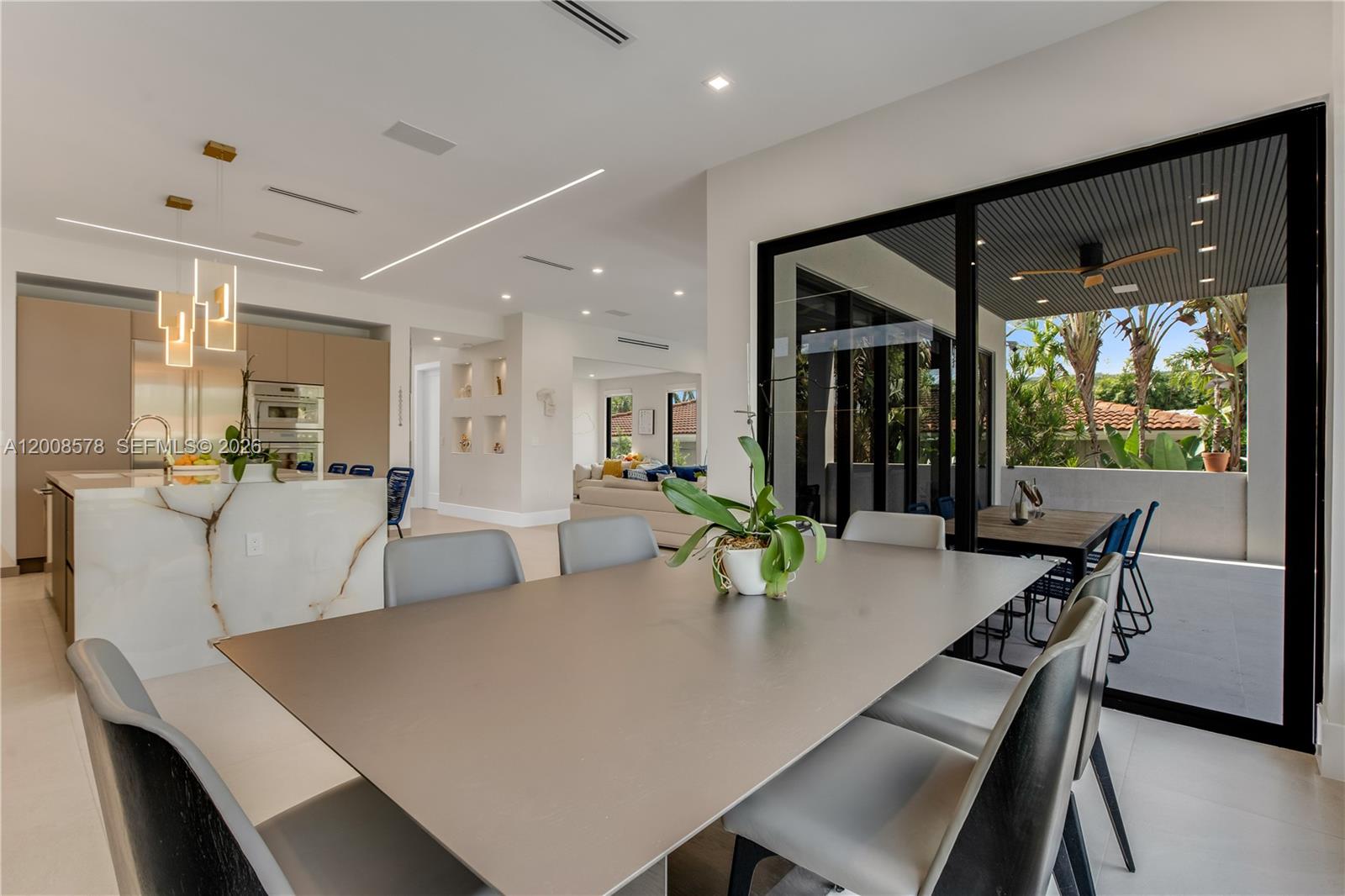 8826 Froude Avenue Surfside, FL 33154 - Photo 21 of 51 a view of a dining room with furniture