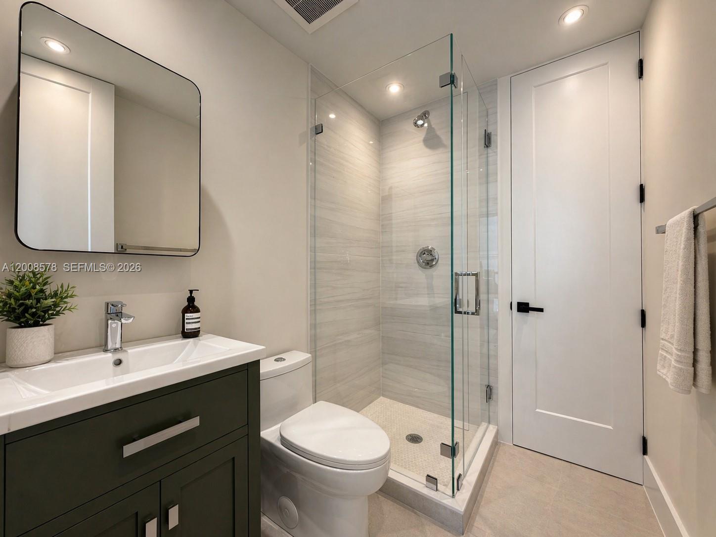 8826 Froude Avenue Surfside, FL 33154 - Photo 34 of 51 a bathroom with a sink toilet and shower
