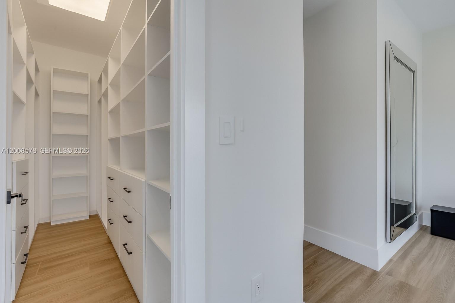 8826 Froude Avenue Surfside, FL 33154 - Photo 41 of 51 a view of a hallway with wooden floor and entryway