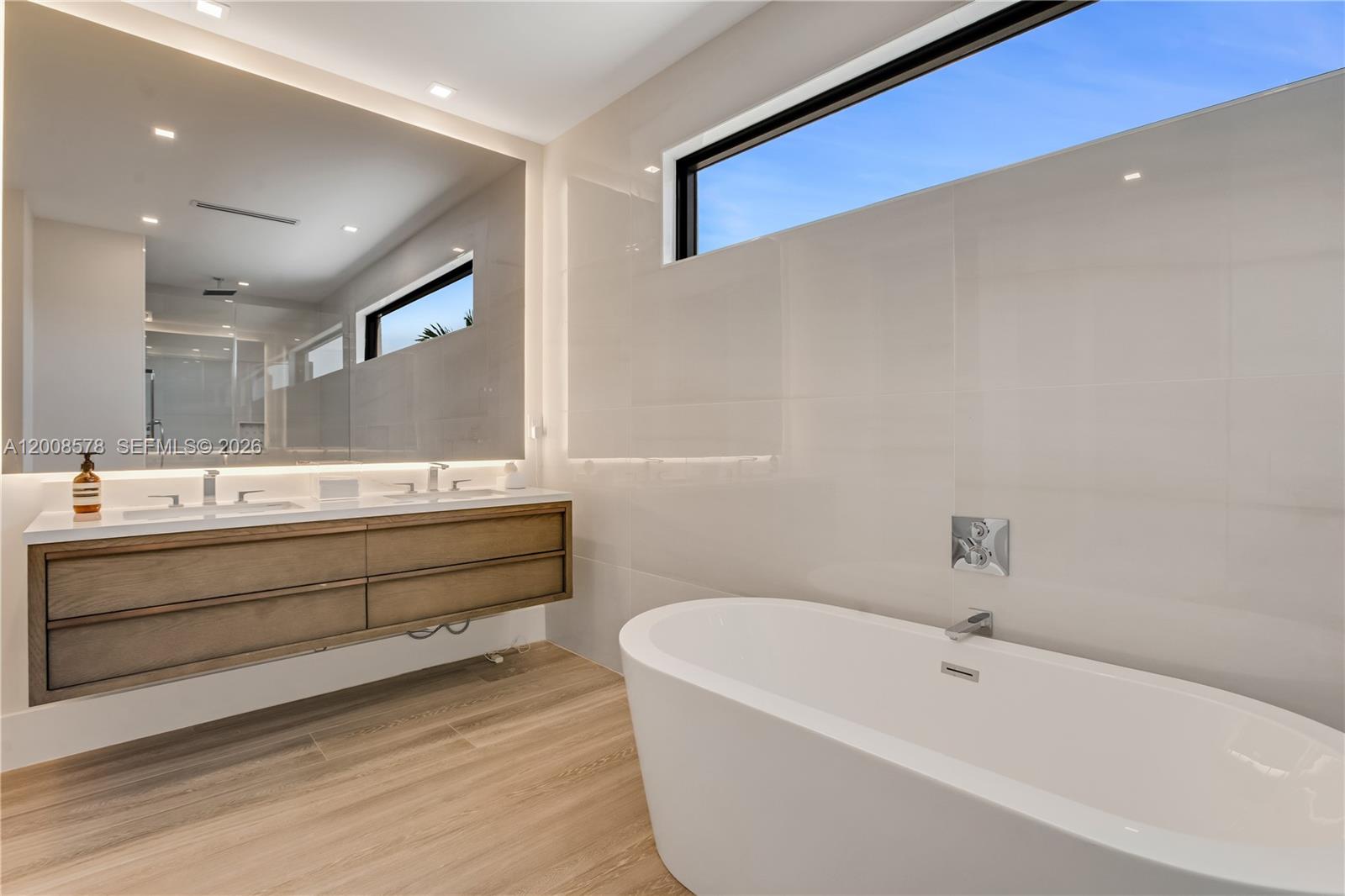 8826 Froude Avenue Surfside, FL 33154 - Photo 43 of 51 a bathroom with a bathtub and a sink