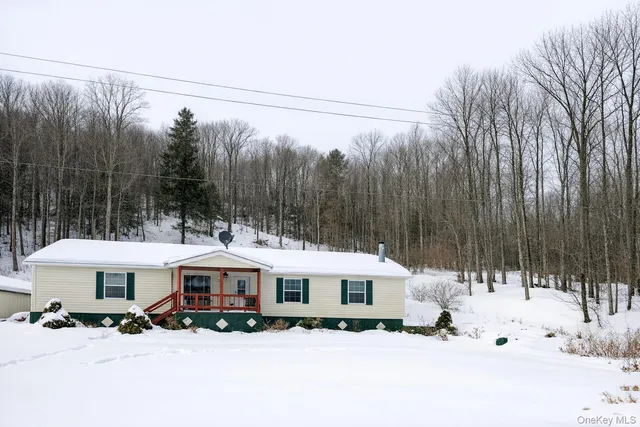 a front view of a house with a wooden fence