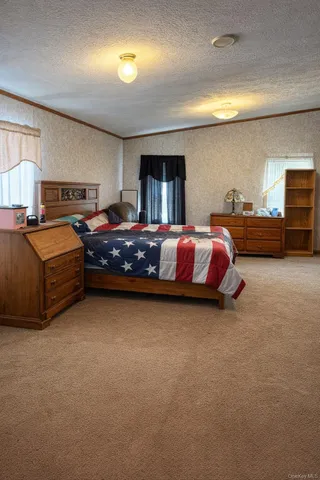 a bed room with bed and window