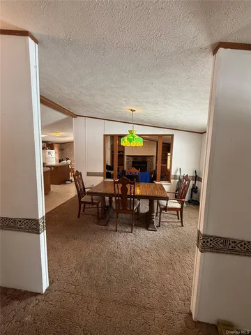 a view of a living room and dining room