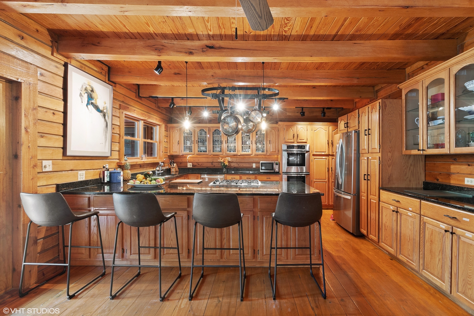 8309 Crystal Springs Road Bull Valley, IL 60098 - Photo 4 of 14 a kitchen with a table chairs stove and cabinets