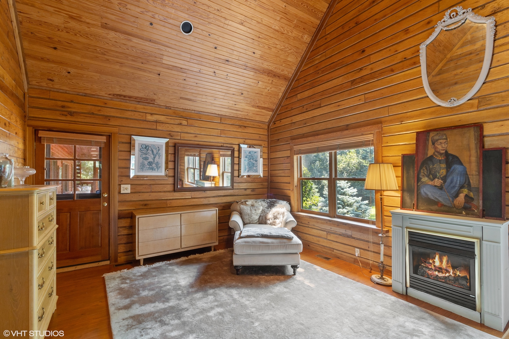 8309 Crystal Springs Road Bull Valley, IL 60098 - Photo 7 of 14 a room with furniture and a fireplace