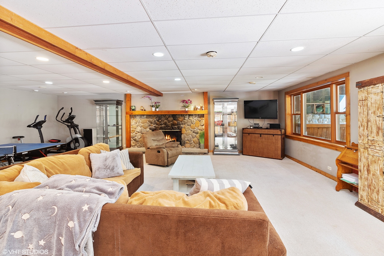 8309 Crystal Springs Road Bull Valley, IL 60098 - Photo 10 of 14 a view of a livingroom with furniture and a flat screen tv
