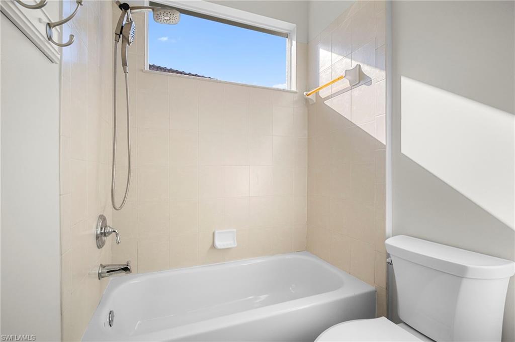 7915 Founders Circle Naples, FL 34104 - Photo 18 of 25 Bathroom with toilet and bathing tub / shower combination