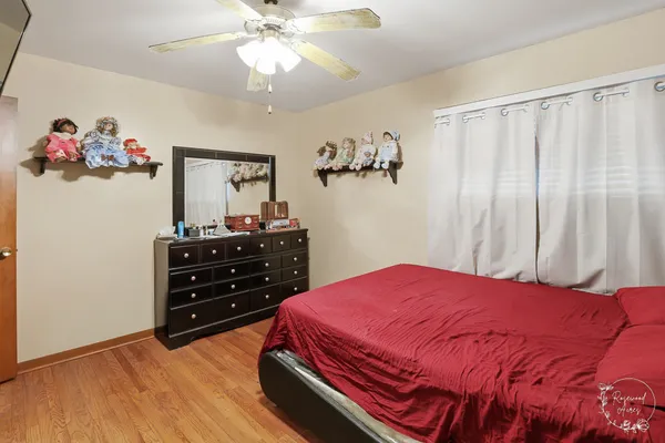 a bedroom with a bed and a dresser