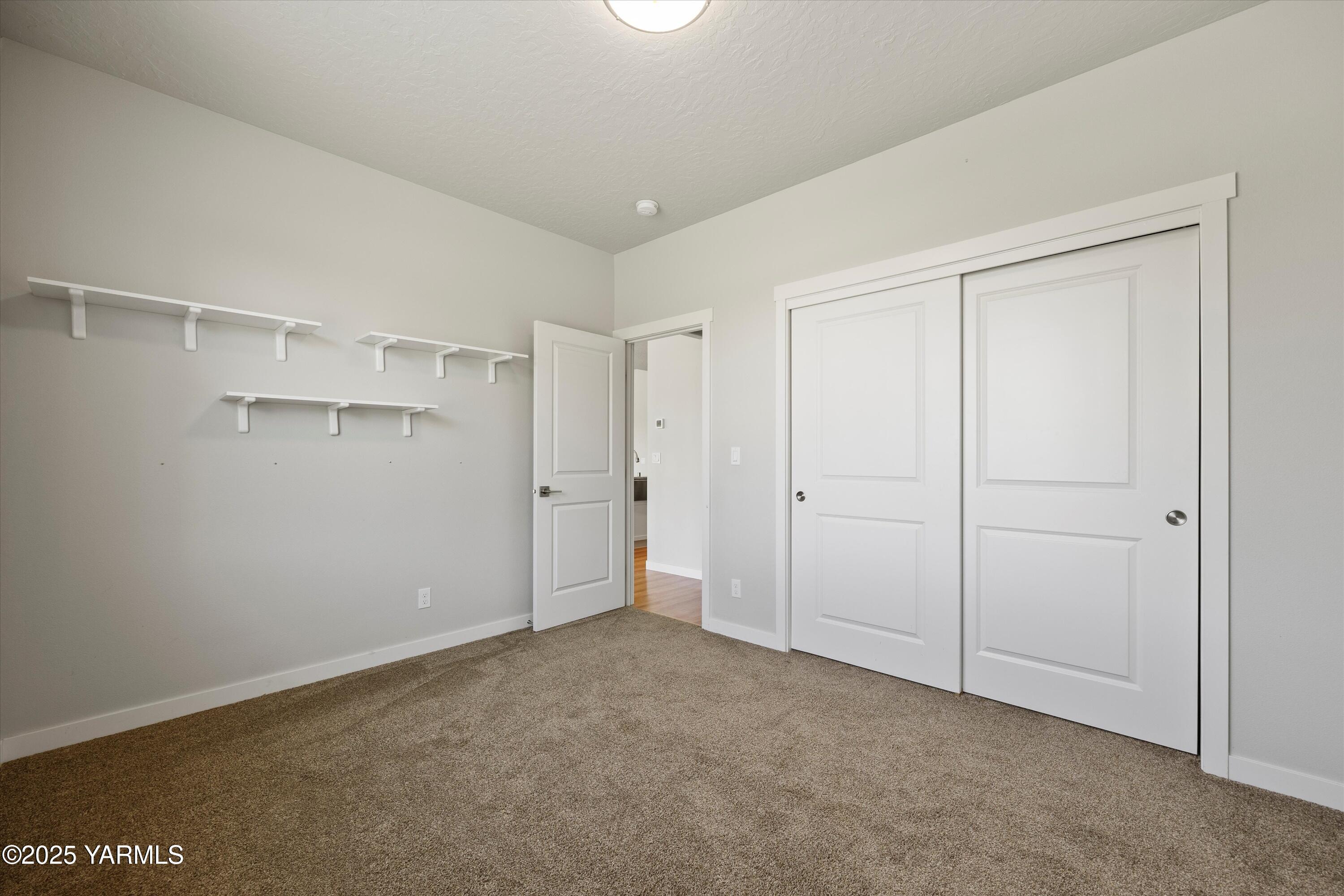 172004 Northwest Dogwood Road Grandview, WA 98930 - Photo 29 of 41 Bedroom on the left side of the home.