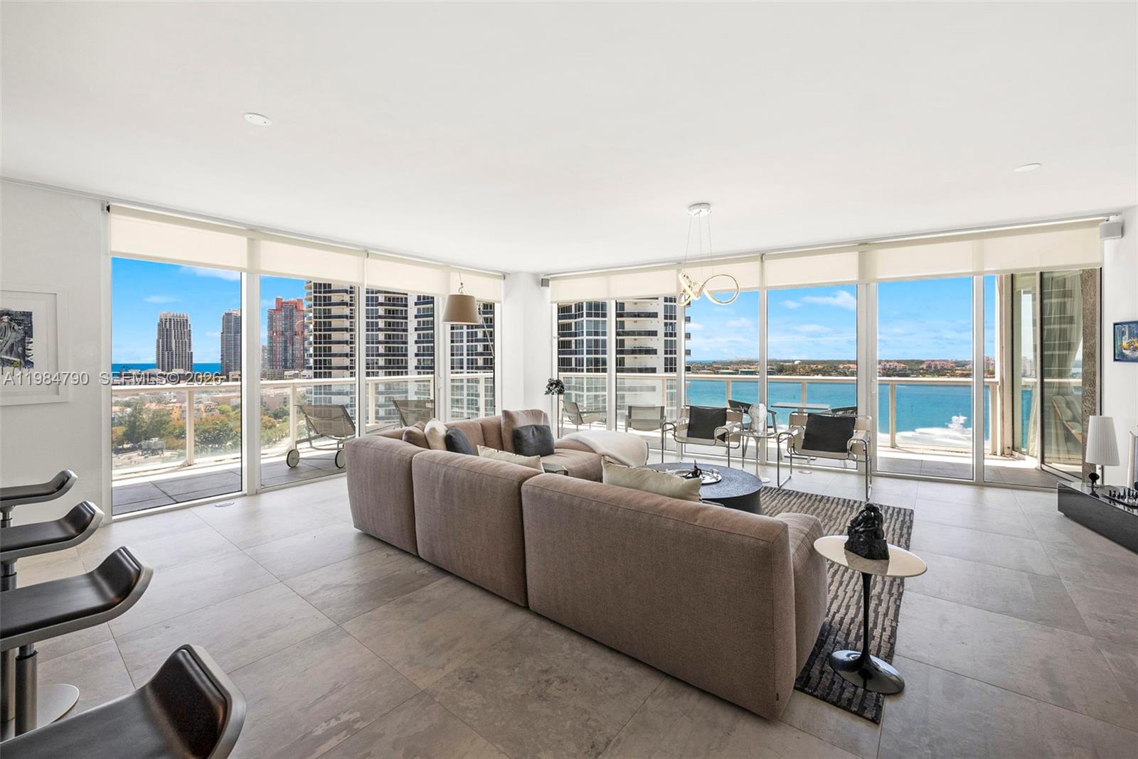 450 Alton Road, Unit 1507 Miami Beach, FL 33139 - Photo 13 of 72 a living room with furniture and a large window