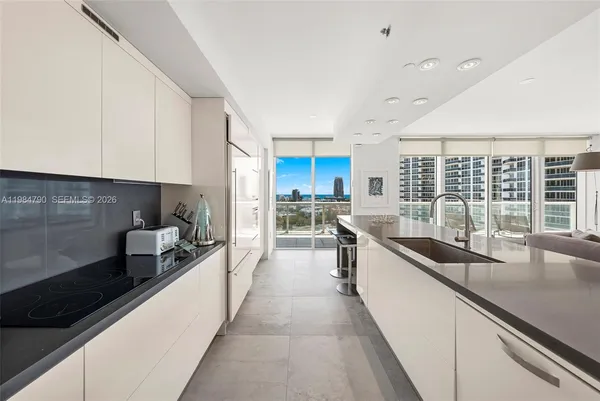 a spacious bedroom with a bed and a couch