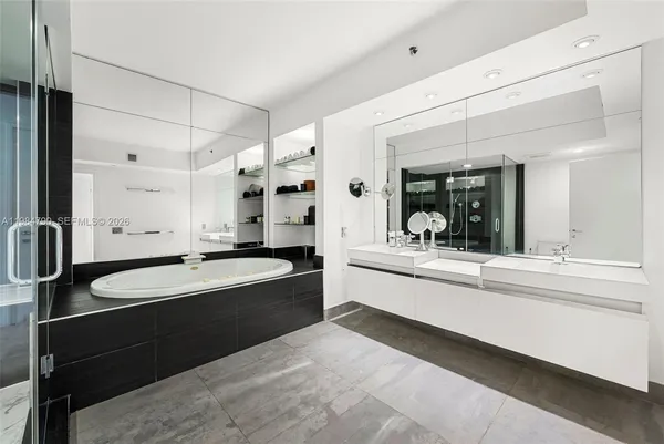 a view of swimming pool with a garden and palm trees