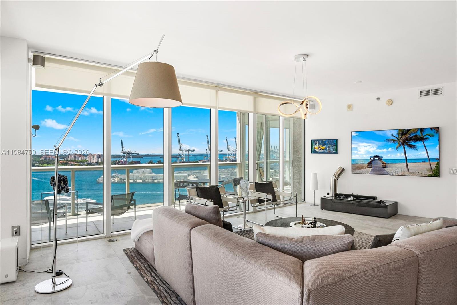 450 Alton Road, Unit 1507 Miami Beach, FL 33139 - Photo 4 of 72 a living room with furniture and a large window
