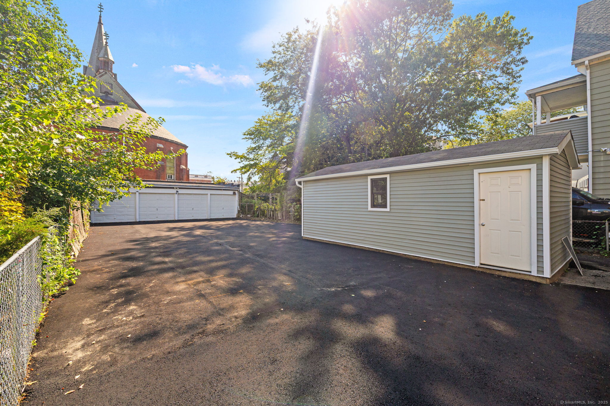 530 Jane Street, Unit 1 Bridgeport, CT 06608 - Photo 4 of 10 a view of a house with a yard and garage
