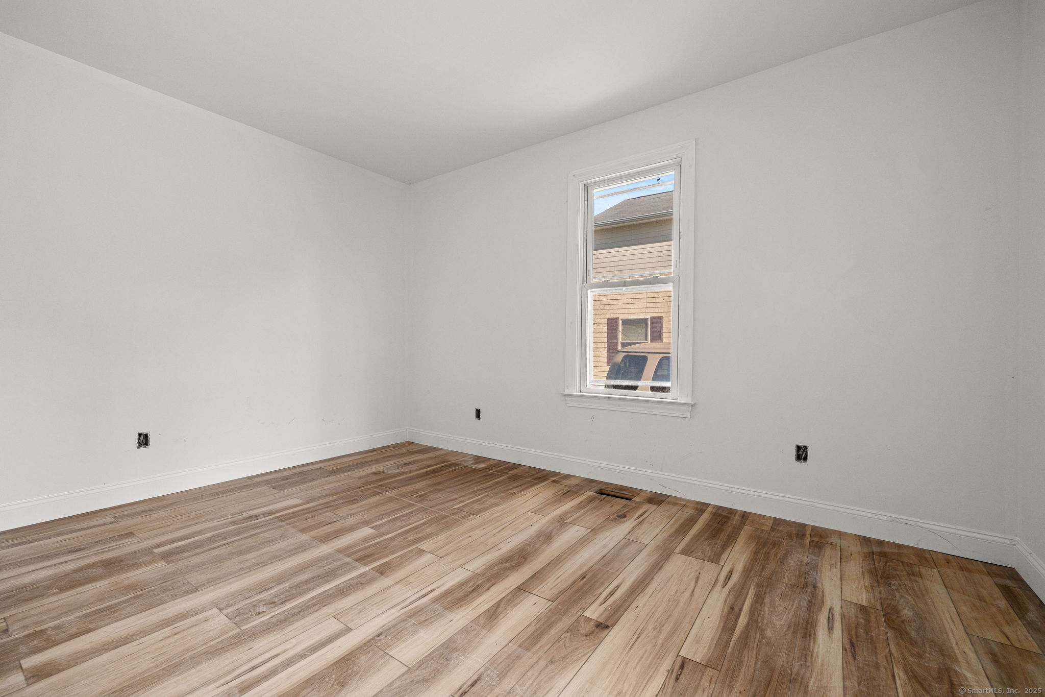 530 Jane Street, Unit 1 Bridgeport, CT 06608 - Photo 9 of 10 a view of empty room with wooden floor