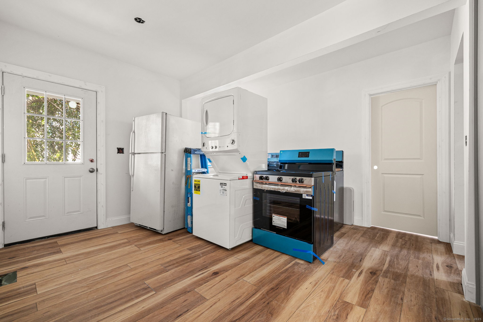 530 Jane Street, Unit 1 Bridgeport, CT 06608 - Photo 10 of 10 a kitchen with a refrigerator and a stove top oven