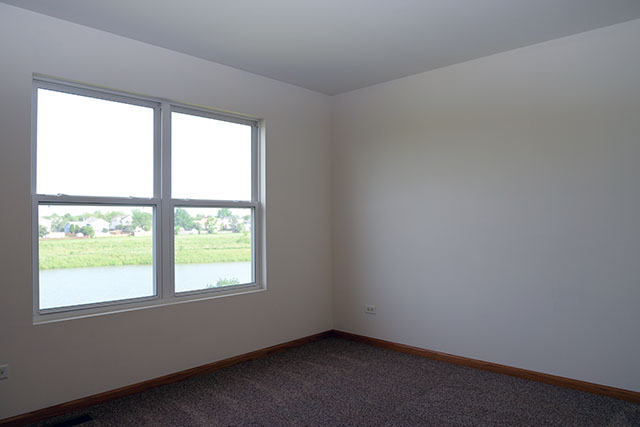 25148 Spring Street Manhattan, IL 60442 - Photo 13 of 15 an empty room with a window