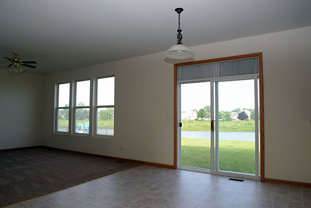 25148 Spring Street Manhattan, IL 60442 - Photo 5 of 15 a view of an empty room with a window
