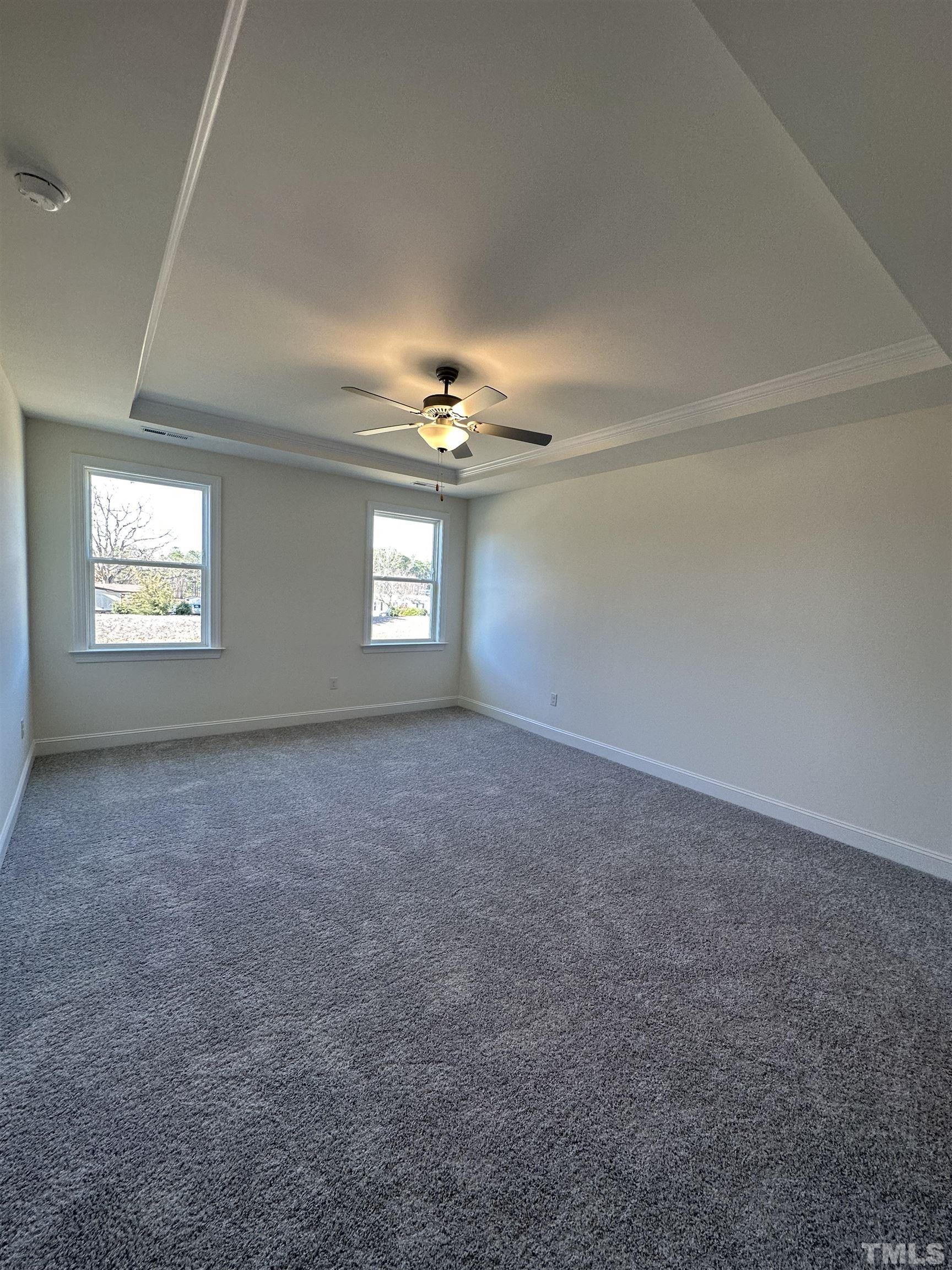 4408 Beckel Road Willow Spring, NC 27592 - Photo 11 of 24 a view of an empty room with a window