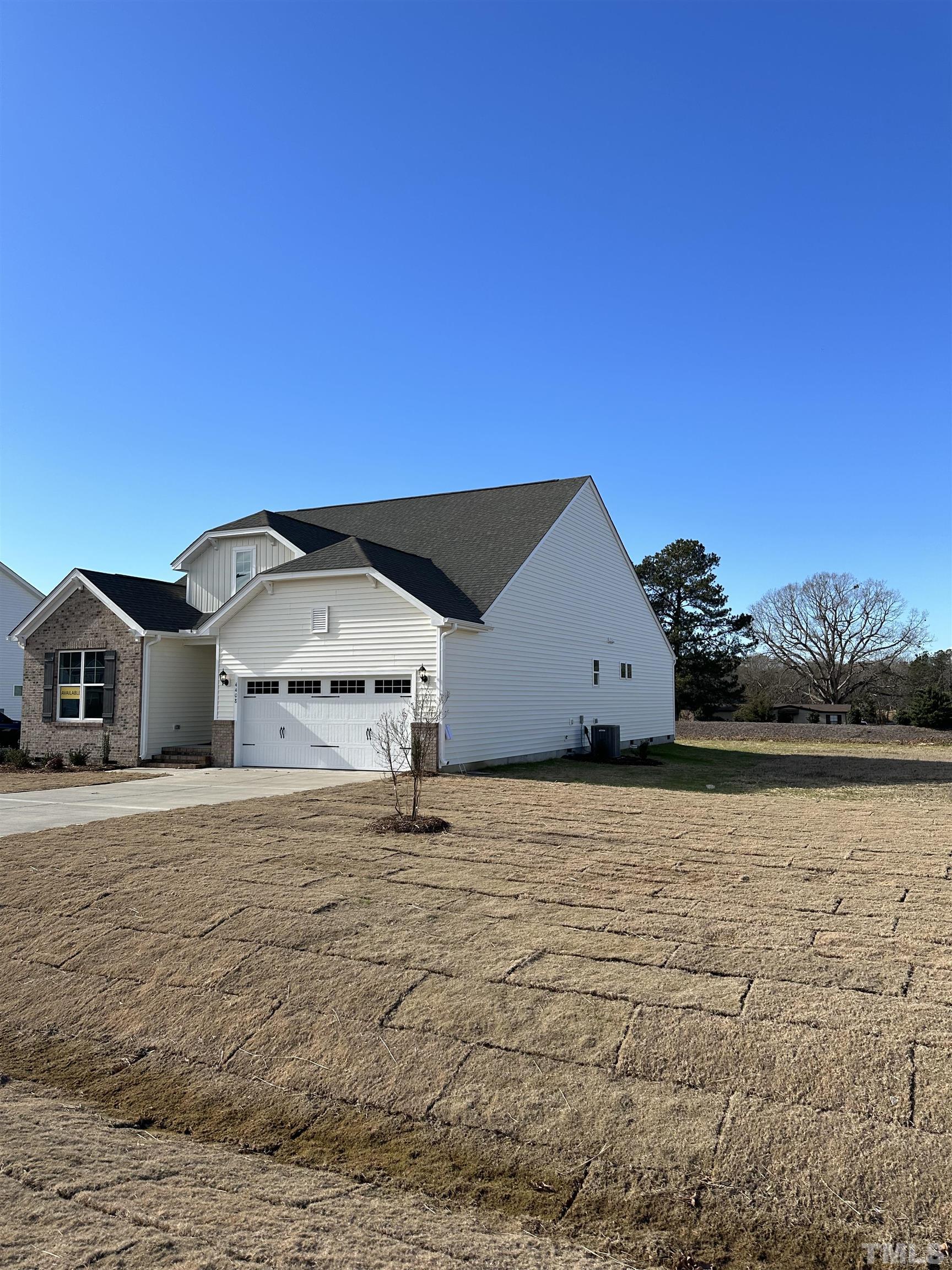 4408 Beckel Road Willow Spring, NC 27592 - Photo 2 of 24 a house with trees in the background