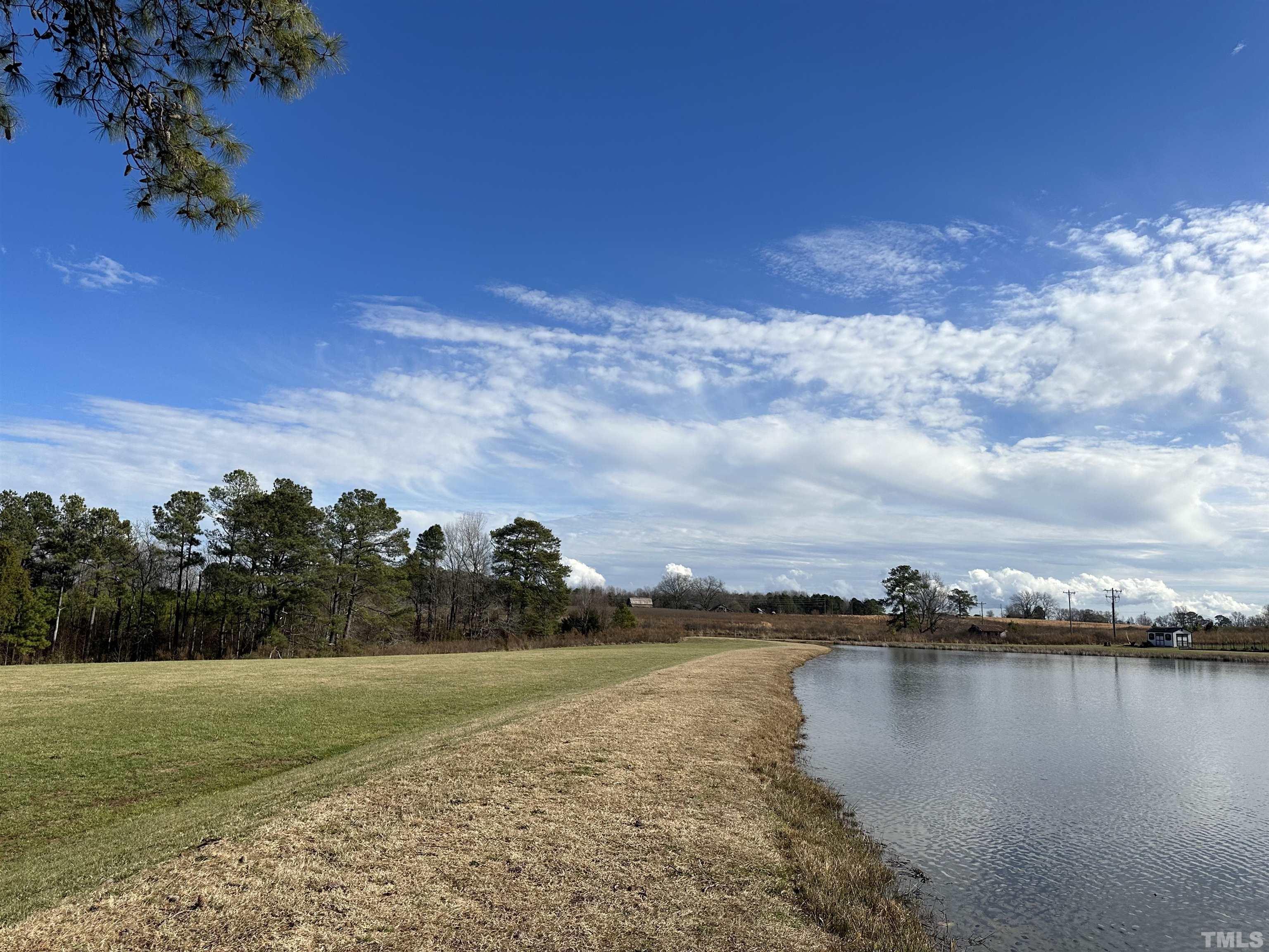 4408 Beckel Road Willow Spring, NC 27592 - Photo 22 of 24 a view of a lake with outdoor space