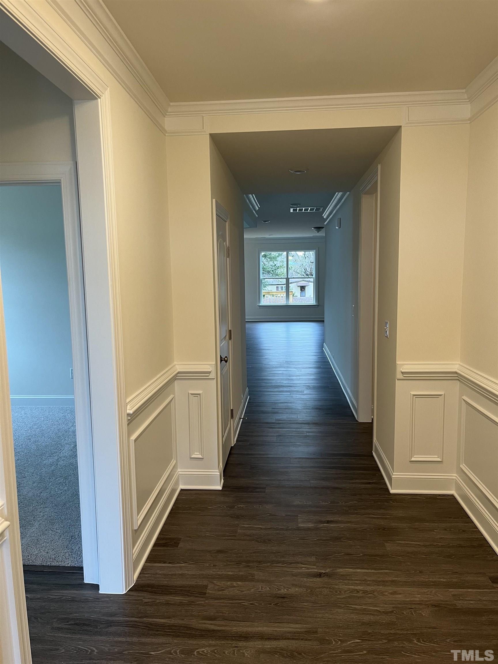 4408 Beckel Road Willow Spring, NC 27592 - Photo 3 of 24 a view of a hallway with wooden floor