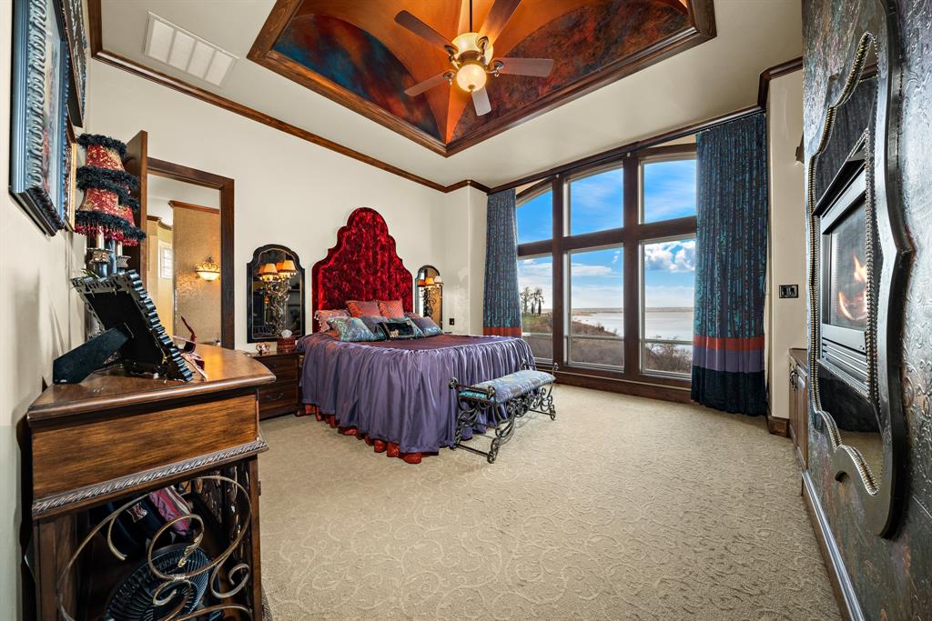 1252 Briar Court Whitney, TX 76692 - Photo 17 of 36 a living room with furniture a flat screen tv and a fireplace