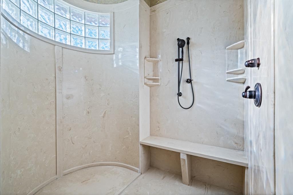 1252 Briar Court Whitney, TX 76692 - Photo 20 of 36 a bathroom with a glass shower door