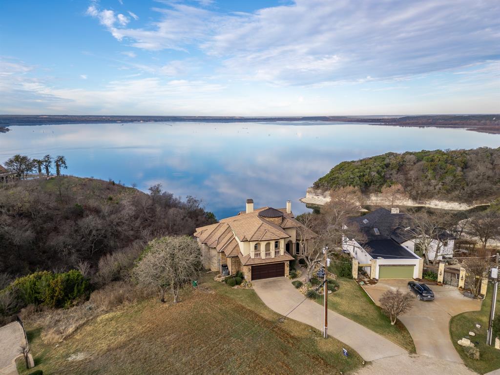 1252 Briar Court Whitney, TX 76692 - Photo 2 of 36 a view of a lake with a mountain in the background