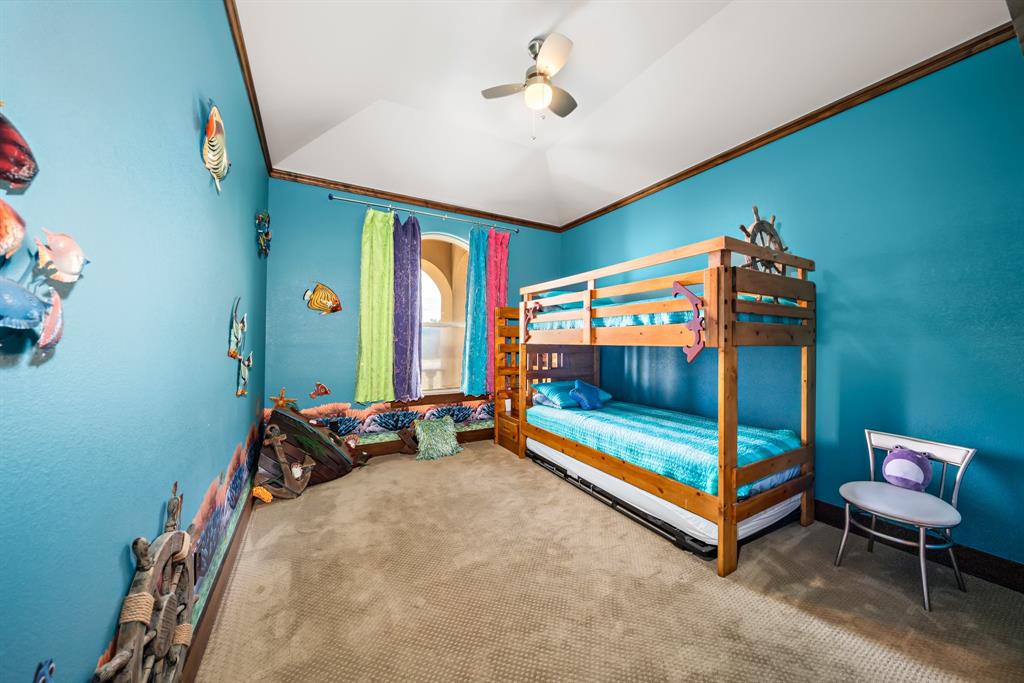 1252 Briar Court Whitney, TX 76692 - Photo 24 of 36 a bedroom with double bunk beds and a ceiling fan