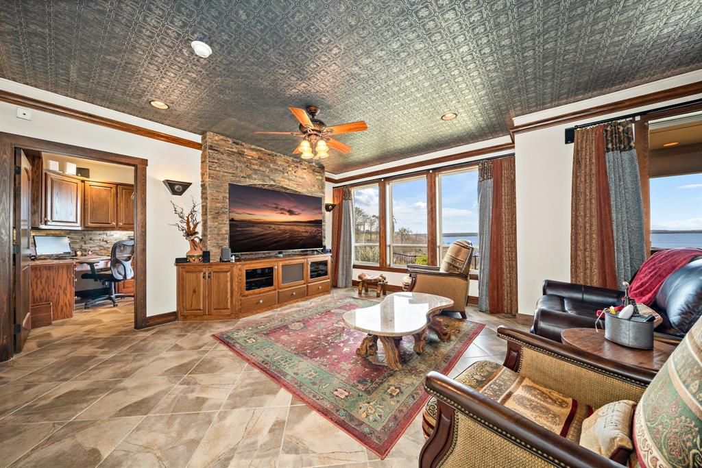 1252 Briar Court Whitney, TX 76692 - Photo 29 of 36 a living room with furniture and a flat screen tv