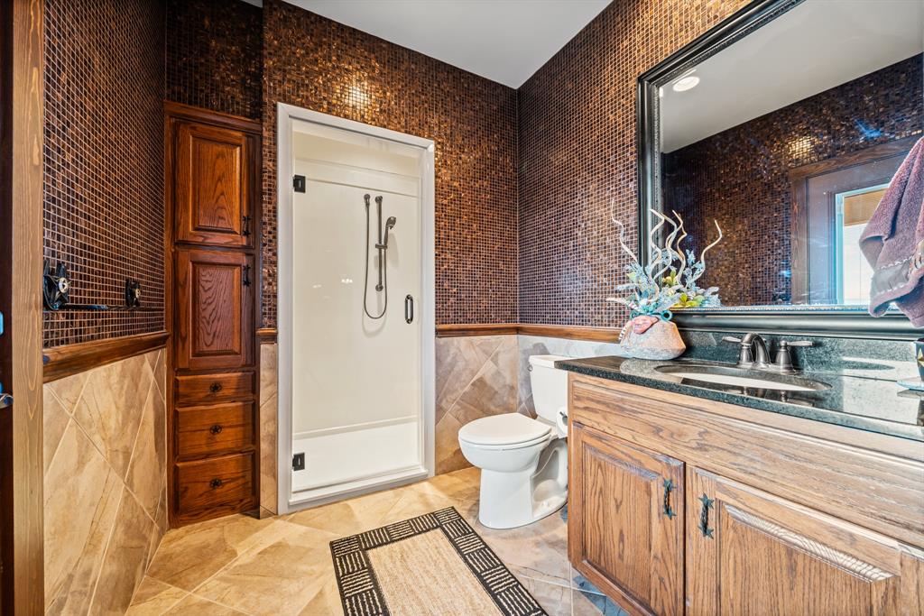 1252 Briar Court Whitney, TX 76692 - Photo 30 of 36 a bathroom with a sink a toilet and shower