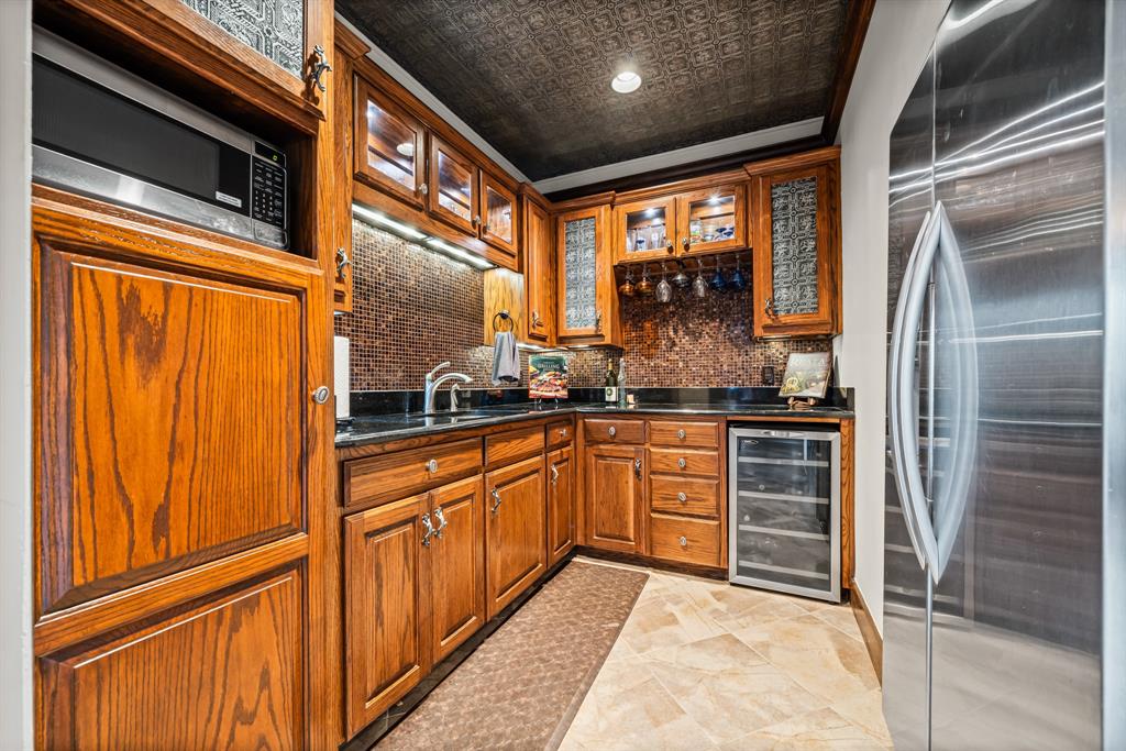 1252 Briar Court Whitney, TX 76692 - Photo 31 of 36 a kitchen with stainless steel appliances granite countertop a refrigerator and a sink