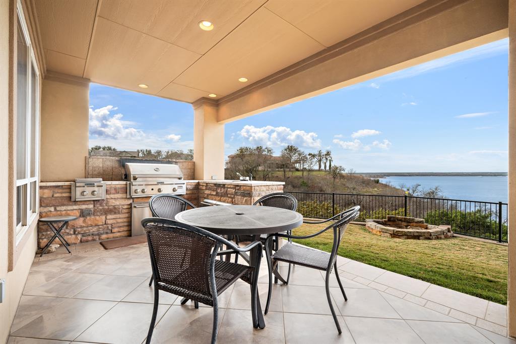 1252 Briar Court Whitney, TX 76692 - Photo 6 of 36 a view of a patio with a table and chairs