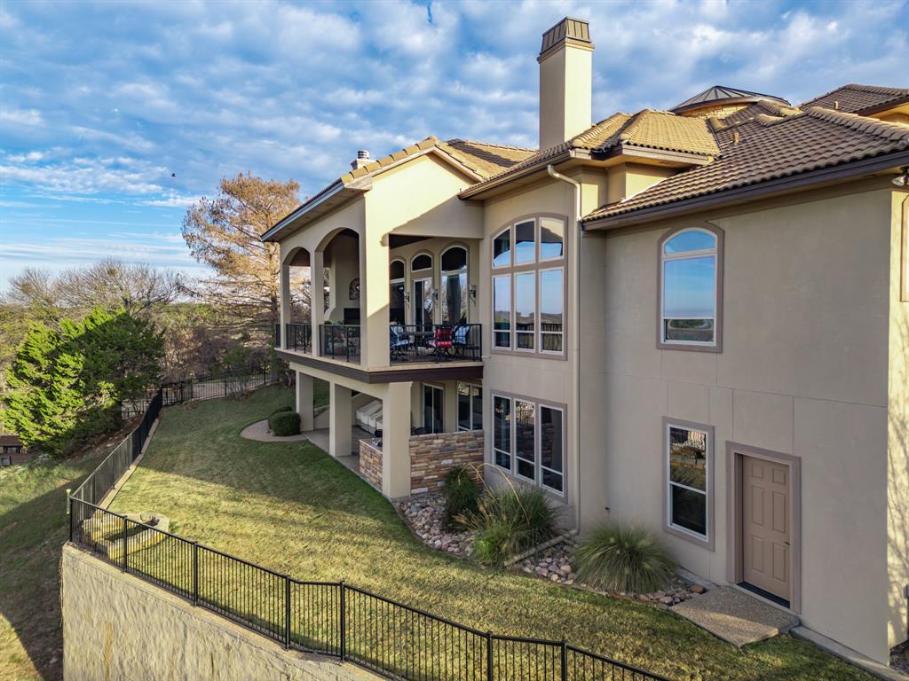 1252 Briar Court Whitney, TX 76692 - Photo 8 of 36 a front view of a house with balcony