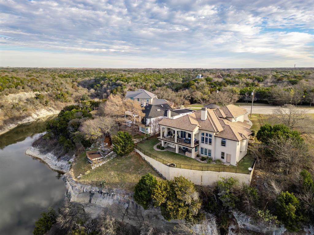 1252 Briar Court Whitney, TX 76692 - Photo 9 of 36 an aerial view of a house with a yard and lake view