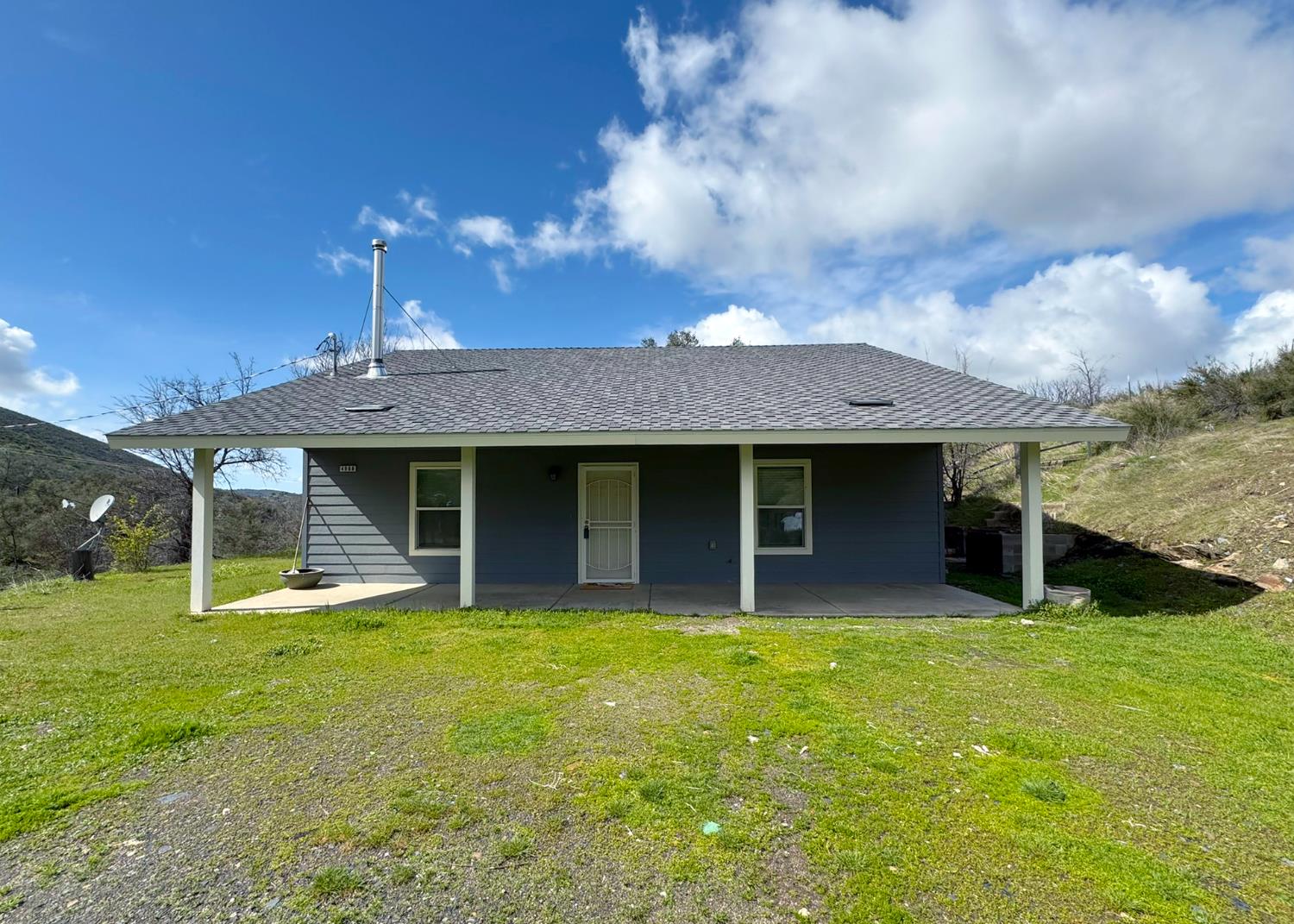 4968 Yaqui Gulch Road Mariposa, CA 95338 - Photo 1 of 37 a view of a house with a yard and sitting area