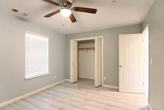 a view of an empty room with a window