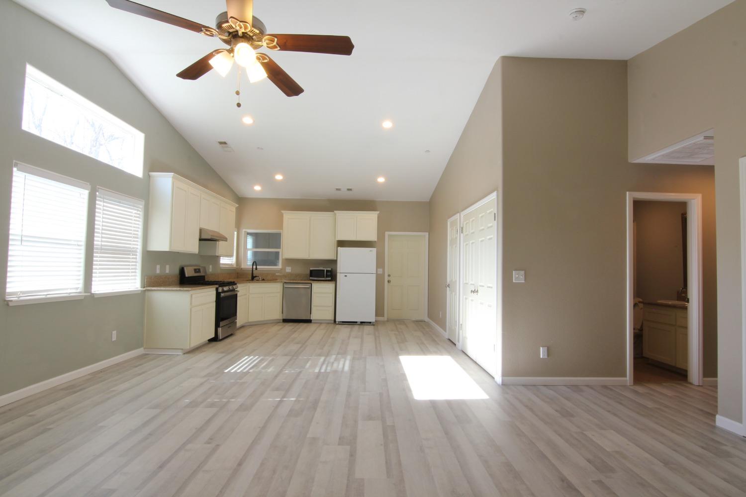 4968 Yaqui Gulch Road Mariposa, CA 95338 - Photo 3 of 37 a view of kitchen with refrigerator microwave and window