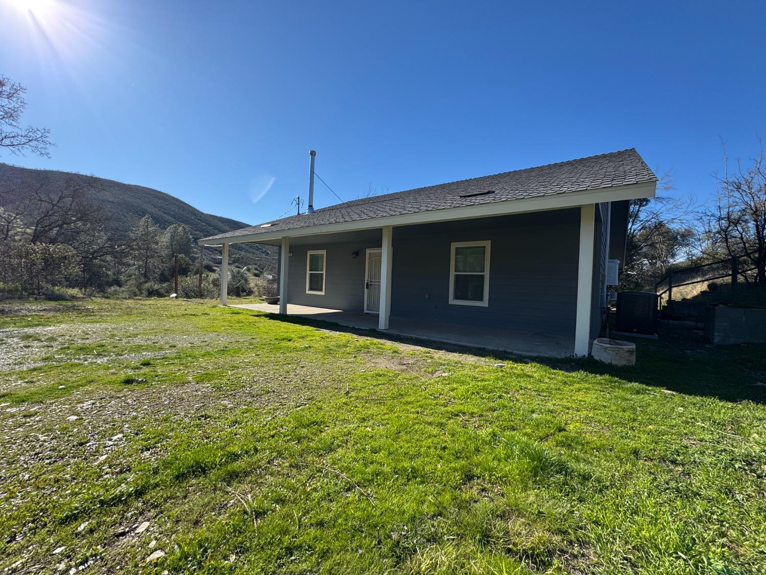 4968 Yaqui Gulch Road Mariposa, CA 95338 - Photo 31 of 37 a view of a house with a yard
