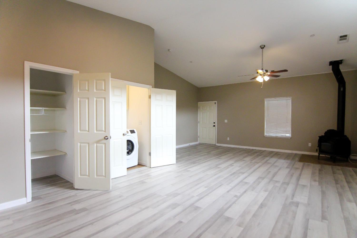 4968 Yaqui Gulch Road Mariposa, CA 95338 - Photo 6 of 37 a view of a room with wooden floor and a window