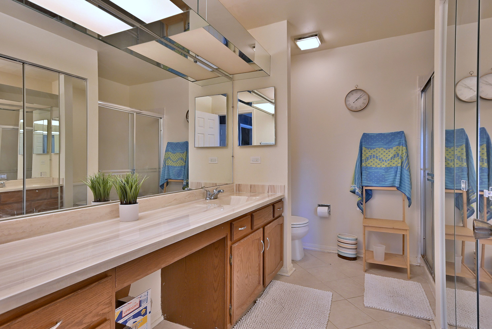 509 Aberdeen Lane, Unit C Prospect Heights, IL 60070 - Photo 18 of 27 a bathroom with a granite countertop sink a toilet a mirror and shower