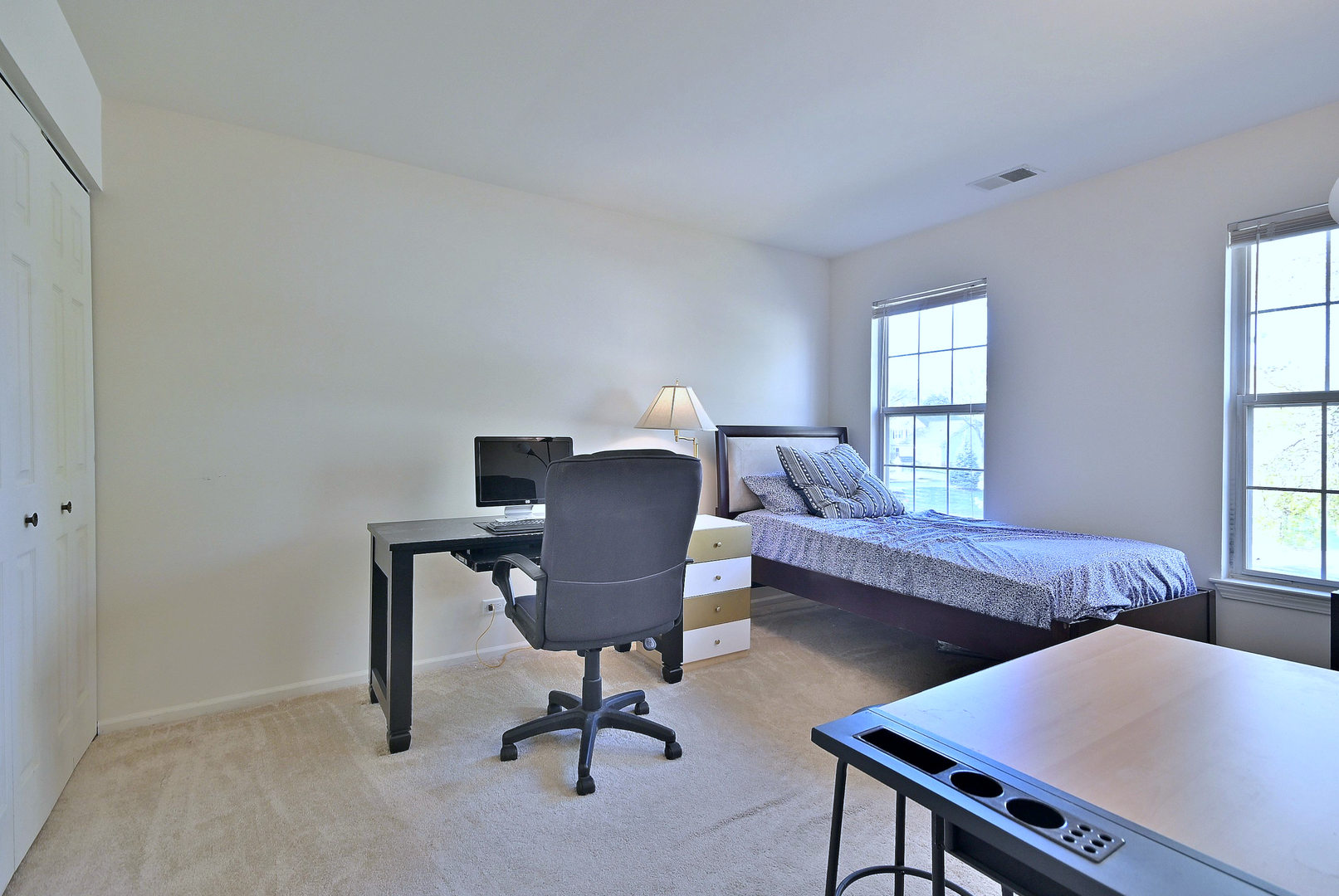 509 Aberdeen Lane, Unit C Prospect Heights, IL 60070 - Photo 19 of 27 a view of a workspace with furniture and a window