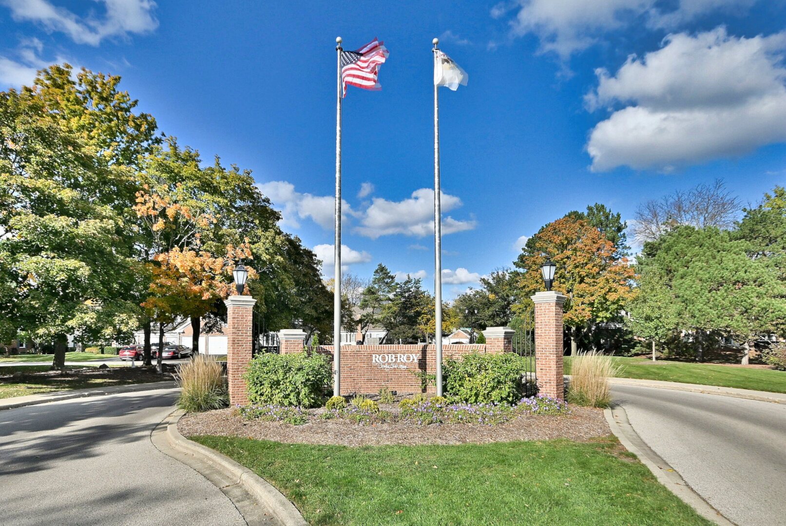 509 Aberdeen Lane, Unit C Prospect Heights, IL 60070 - Photo 25 of 27 a view of a house with a yard and potted plants