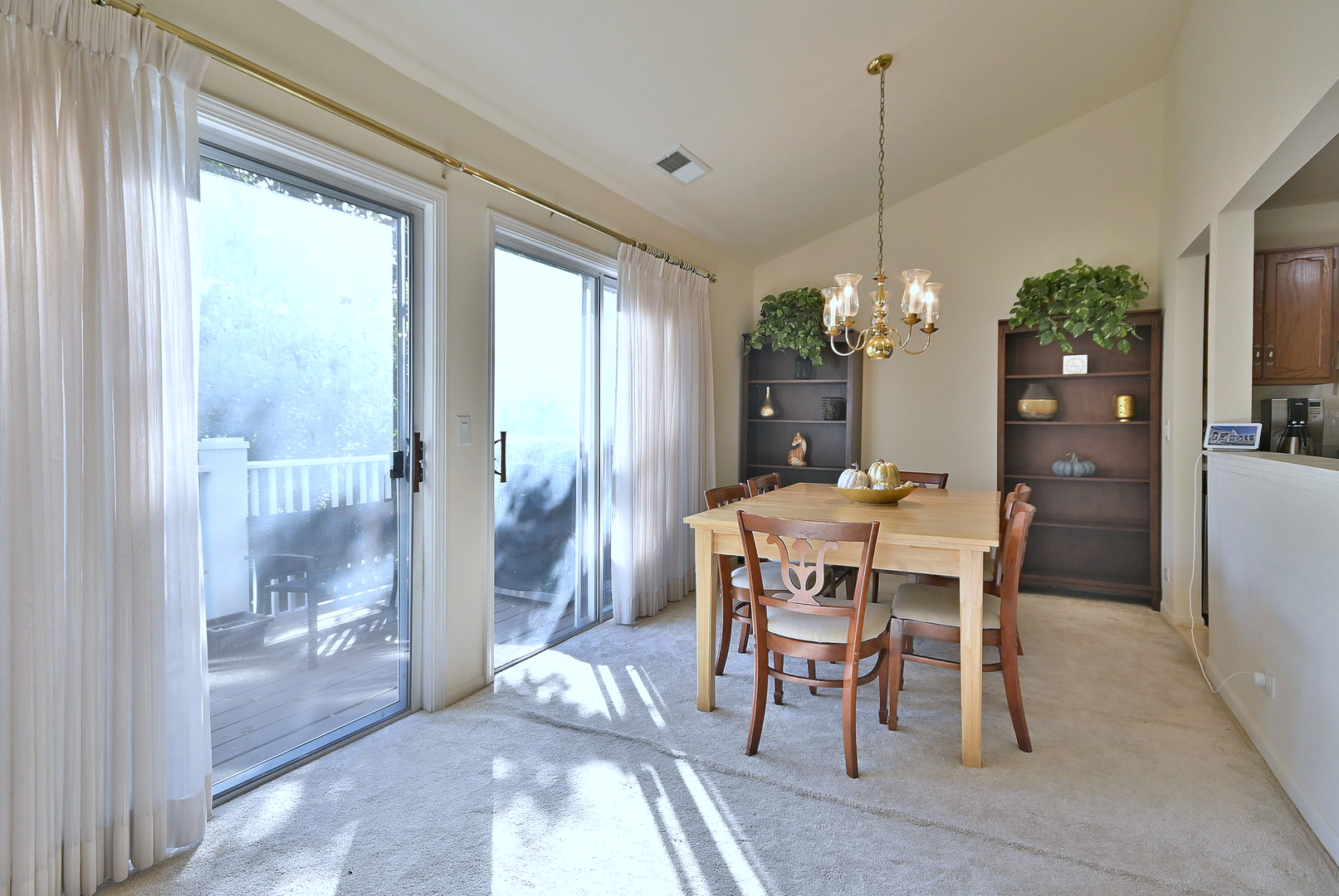 509 Aberdeen Lane, Unit C Prospect Heights, IL 60070 - Photo 5 of 27 a dining room with furniture a chandelier and window