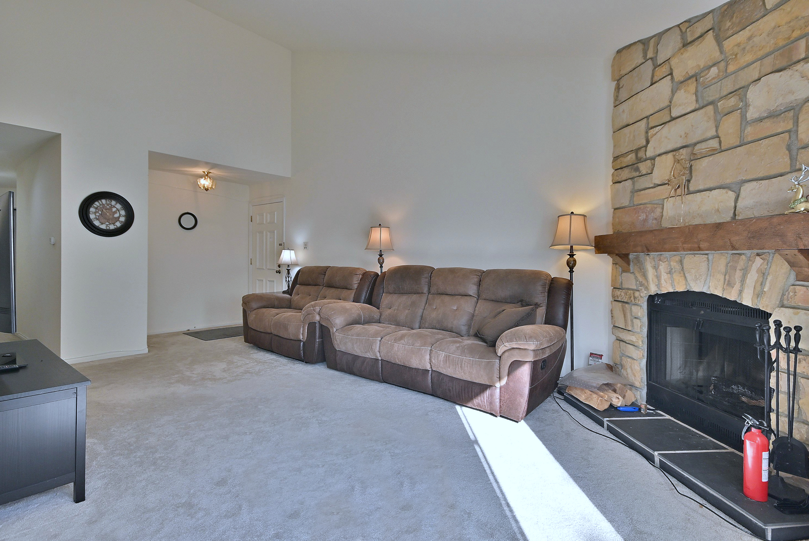 509 Aberdeen Lane, Unit C Prospect Heights, IL 60070 - Photo 7 of 27 a living room with furniture and a fireplace