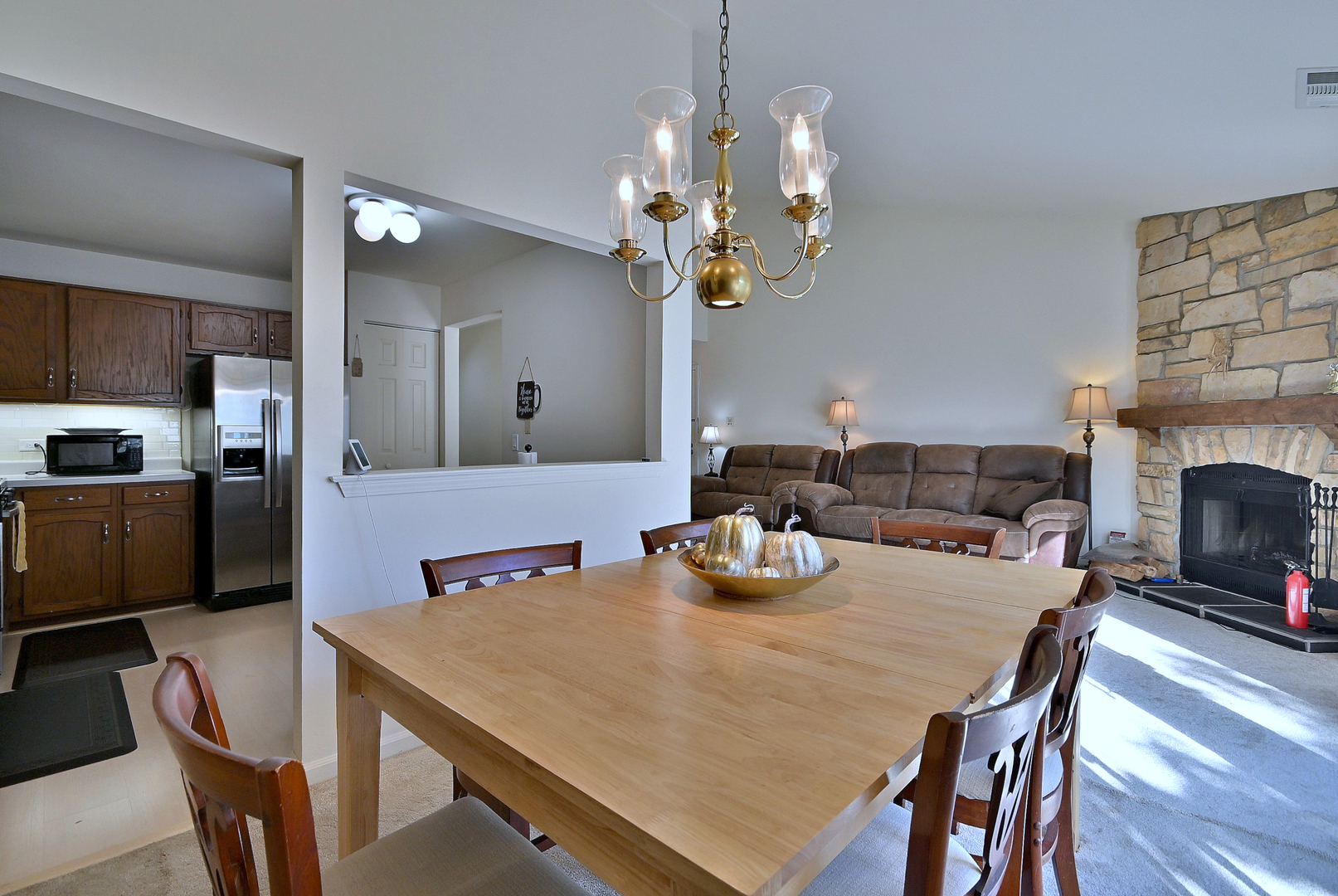 509 Aberdeen Lane, Unit C Prospect Heights, IL 60070 - Photo 9 of 27 a view of a dining room with furniture and wooden floor